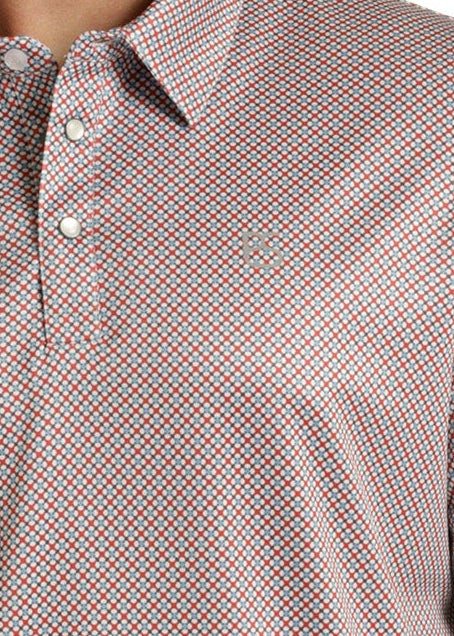 Man wearing a patterned polo shirt and cowboy hat outdoors