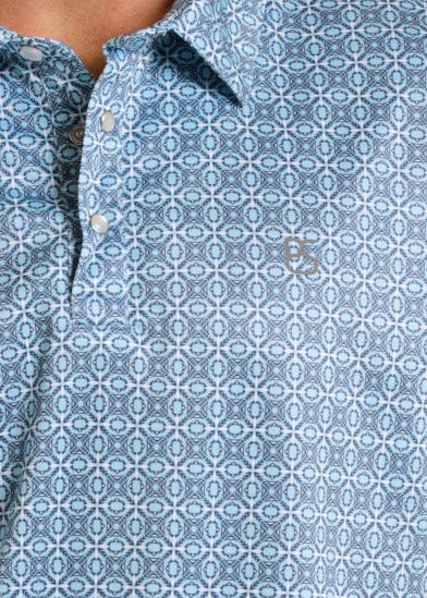 Close up of a men's small aztec print performance pearl snap polo