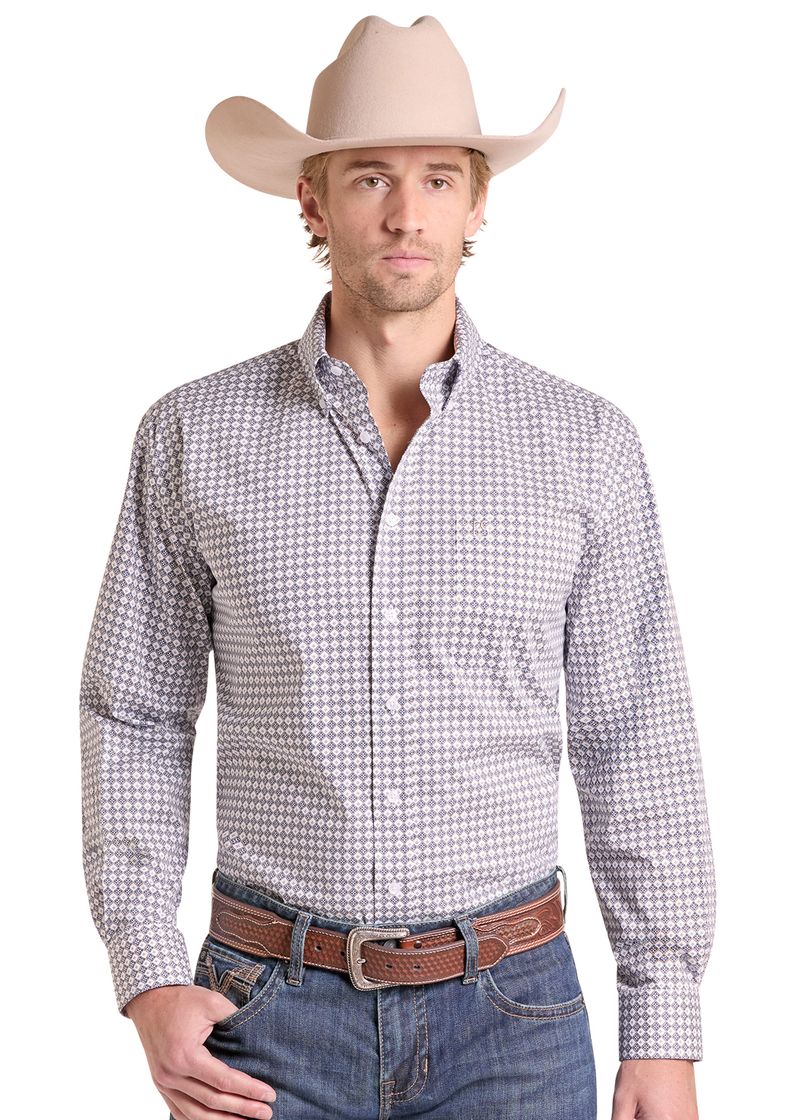 Man wearing a Western button down medallion print shirt. 
