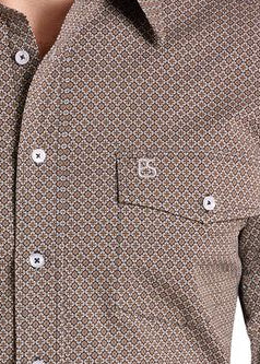 Close-up of a brown and beige patterned button-down shirt with a chest pocket and a small embroidered logo on the pocket.